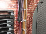brick wall in a gym room with a rack of exercise equipment