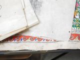 several pieces of paper are sitting on top of a table