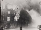 a black and white photo of a fire in a building