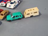 several toy cars are lined up in a row on a table