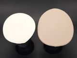 pair of white and black stools on a black surface
