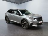 the silver suv is parked in a large room with a black floor
