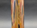 a glass vase that is sitting on a table