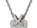 a close up of a diamond heart pendant on a chain