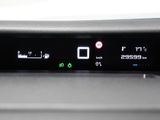 a close up of a car ' s dashboard with a digital display