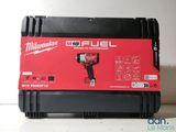 a close up of a box with a drill in it on a table