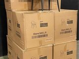 boxes stacked on top of each other with a chair on top of them