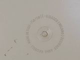 a white plate with a black and white design on it