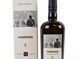 the bottle of hampden 5 is next to the box