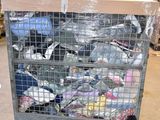 a large metal cage filled with many different types of items