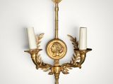 a pair of wall sconces in the form of two candles