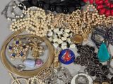 many different types of jewelry on the table