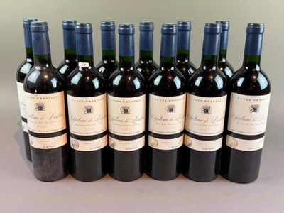 six bottles of wine are lined up in a row on a table