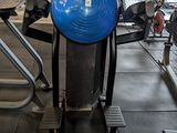 a blue ball on a stand in a gym
