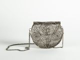 a silver purse with a chain around it on a white background