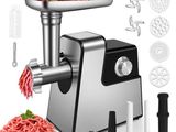 a close up of a meat grinder with meat in it
