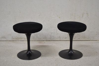 pair of black tulip stools with black velvet seat covers