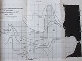 an open book with a black and white picture of a map