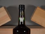 a bottle of wine that is sitting on a table