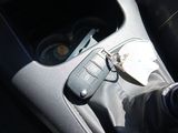 a remote control in the center console of a car