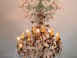 a chandelier hanging from the ceiling in a room