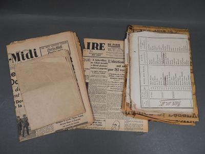three old newspapers sitting on top of a table next to each other