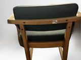 a chair that is sitting next to a table