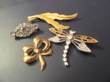 three brooches that are sitting on a table