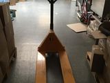 a forklift in the middle of a warehouse with boxes