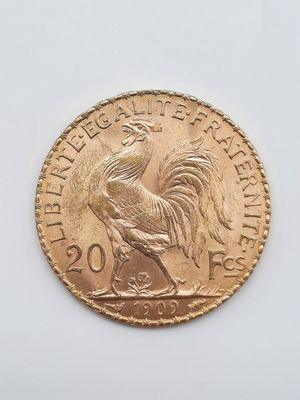 l'image d'une pièce d'or ornée d'un coq