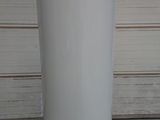 a water heater sitting on a pallet in a garage