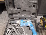 a tool that is sitting in a case on the floor