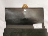 michael korsh black leather clutch bag with gold lion handle
