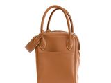 a brown leather handbag with a strap on the handle
