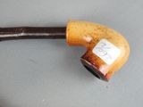 a pipe with a sticker on it sitting on a table