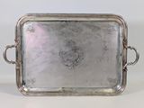 a silver tray with handles and handles on a white surface