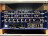 a close up of a rack with many electronic equipment in it