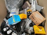 a cardboard box filled with electronics and other items
