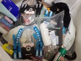 a white trash can filled with assorted items