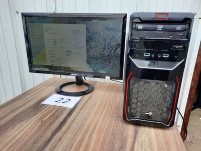 a desktop computer sitting on top of a wooden desk