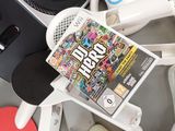 a video game on a table next to a cd player