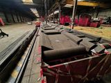 a lot of pipes that are sitting in a warehouse