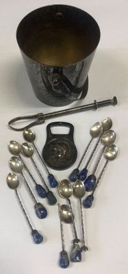 a lot of silver spoons and a bowl on the table