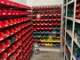 many bins of different colors and sizes in this room