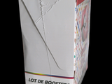 a white box that has a pair of scissors in it