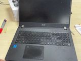 a laptop that is sitting on a desk in front of a computer monitor