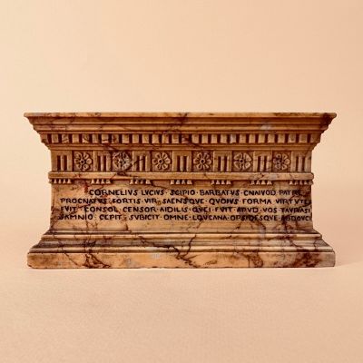 an image of a statue with writing on it sitting on a table