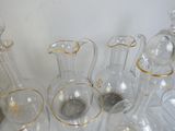 a lot of glass vases that are sitting on a table