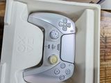 a video game controller sitting in a box on a table