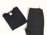 a pair of black pants and a t - shirt on a white background